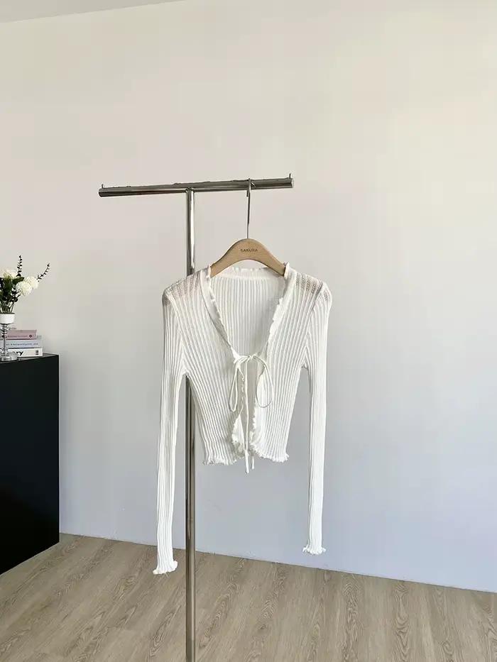 Cardigan en tricot côtelé avec cravate sur le devant, garniture à volants, haut court léger et trans