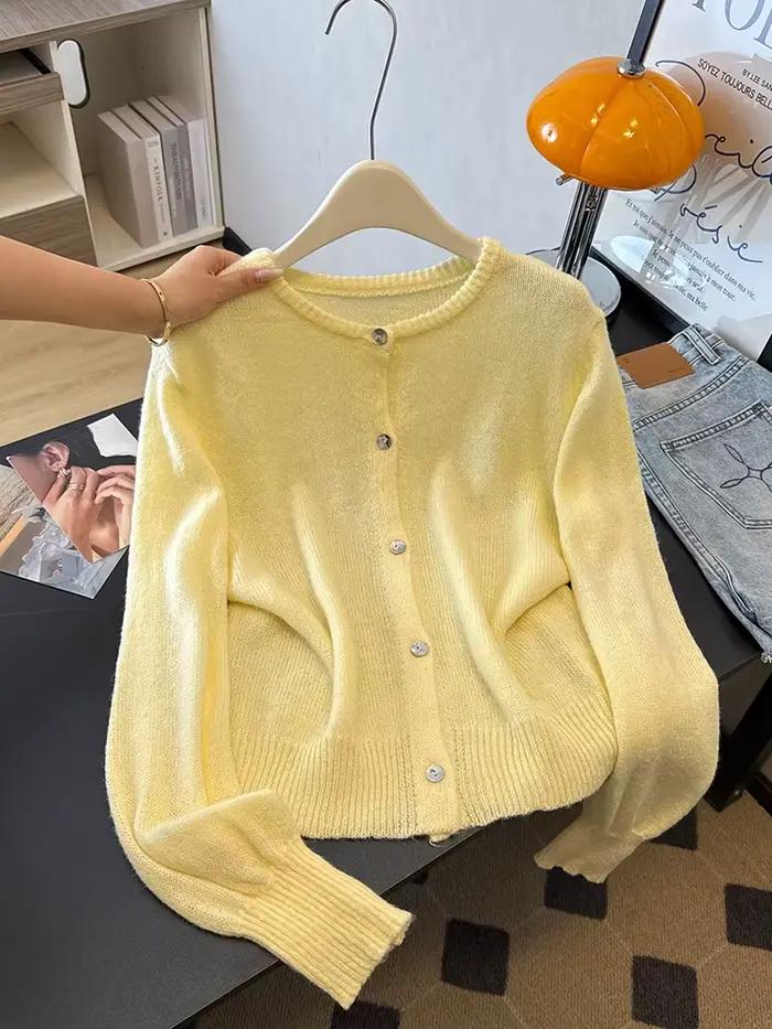 Un cardigan élégant, ample et léger à col rond