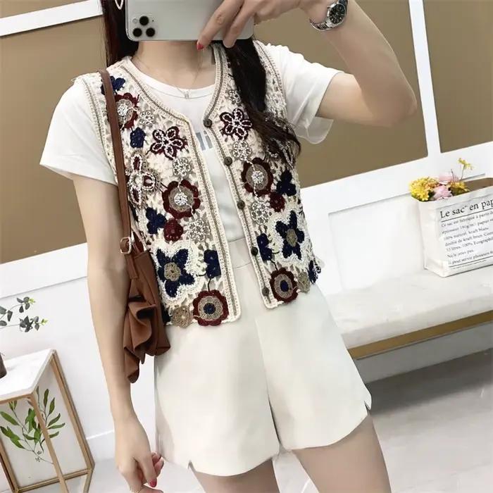 Gilet sans manches en tricot ajouré pour femme