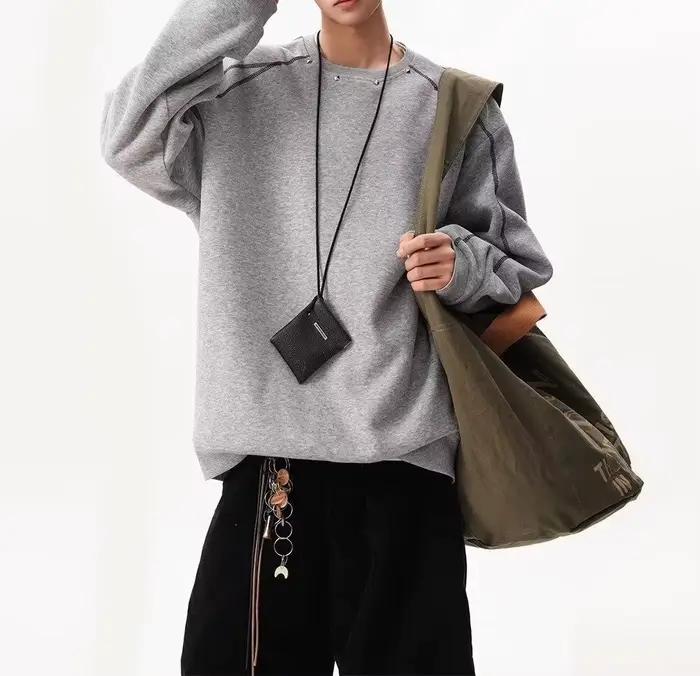 Pull décoratif à rivets pour hommes et femmes