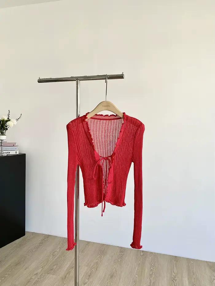 Cardigan en tricot côtelé avec cravate sur le devant