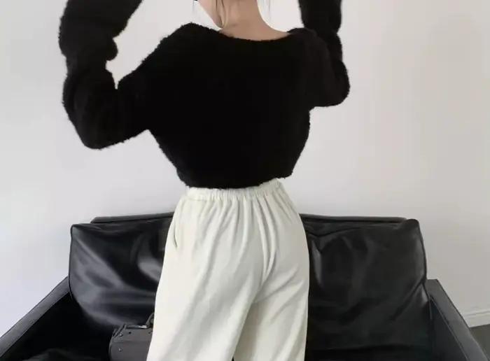 Pull en fil bouclé à manches en corne pour femme