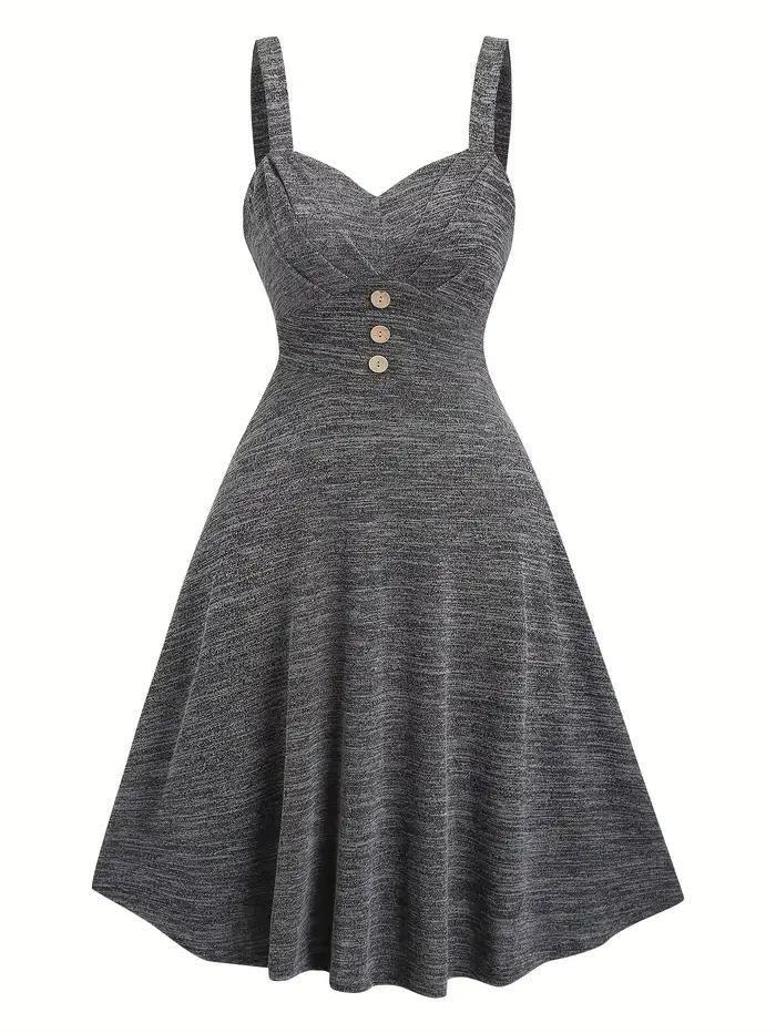 Un ensemble deux pièces d'un cardigan gris foncé confortable avec une robe dos nu pour femme