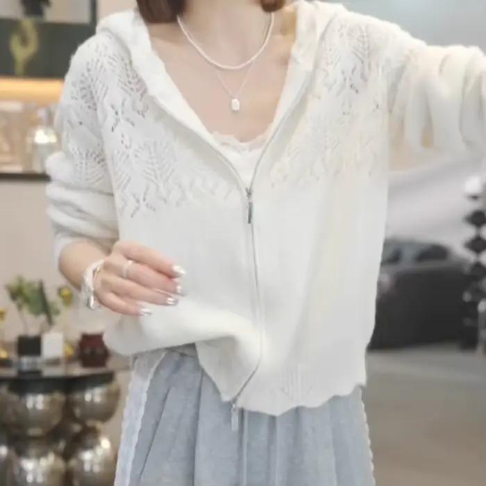 Cardigan tricoté à capuche creuse pour femmes au printemps 2025