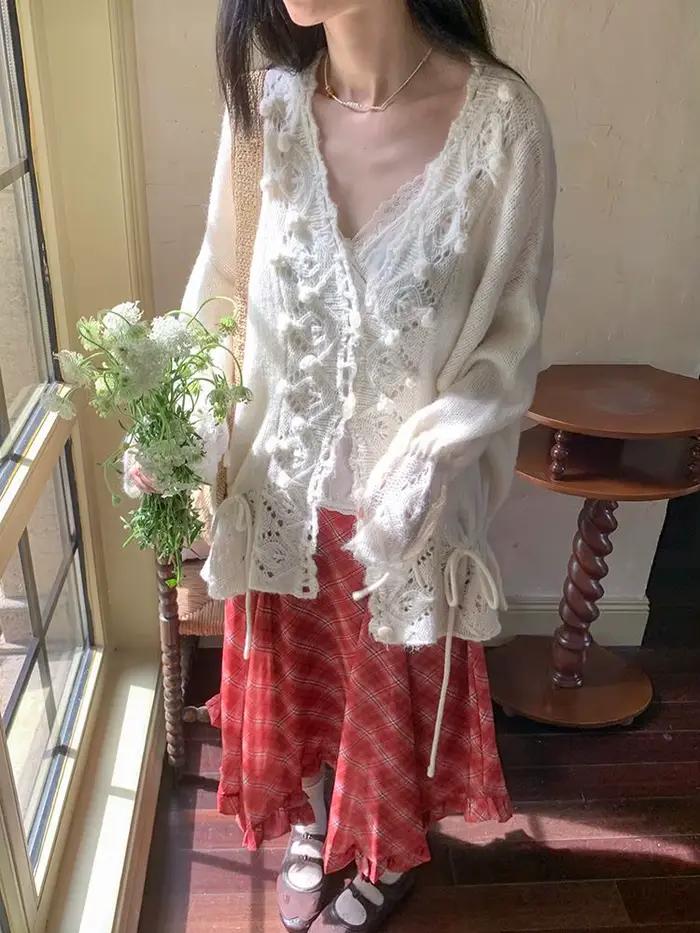 Cardigan en tricot ample à col en V ajouré au crochet pour femme